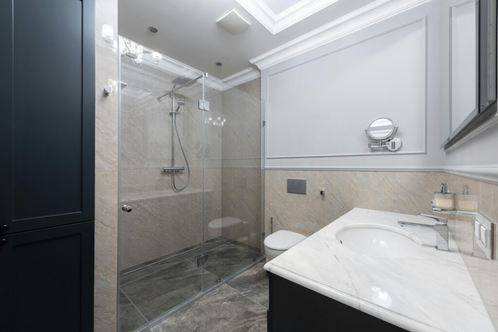 pexels-photo-6587835-6587835 Spacious and elegant bathroom with sleek design and modern amenities.